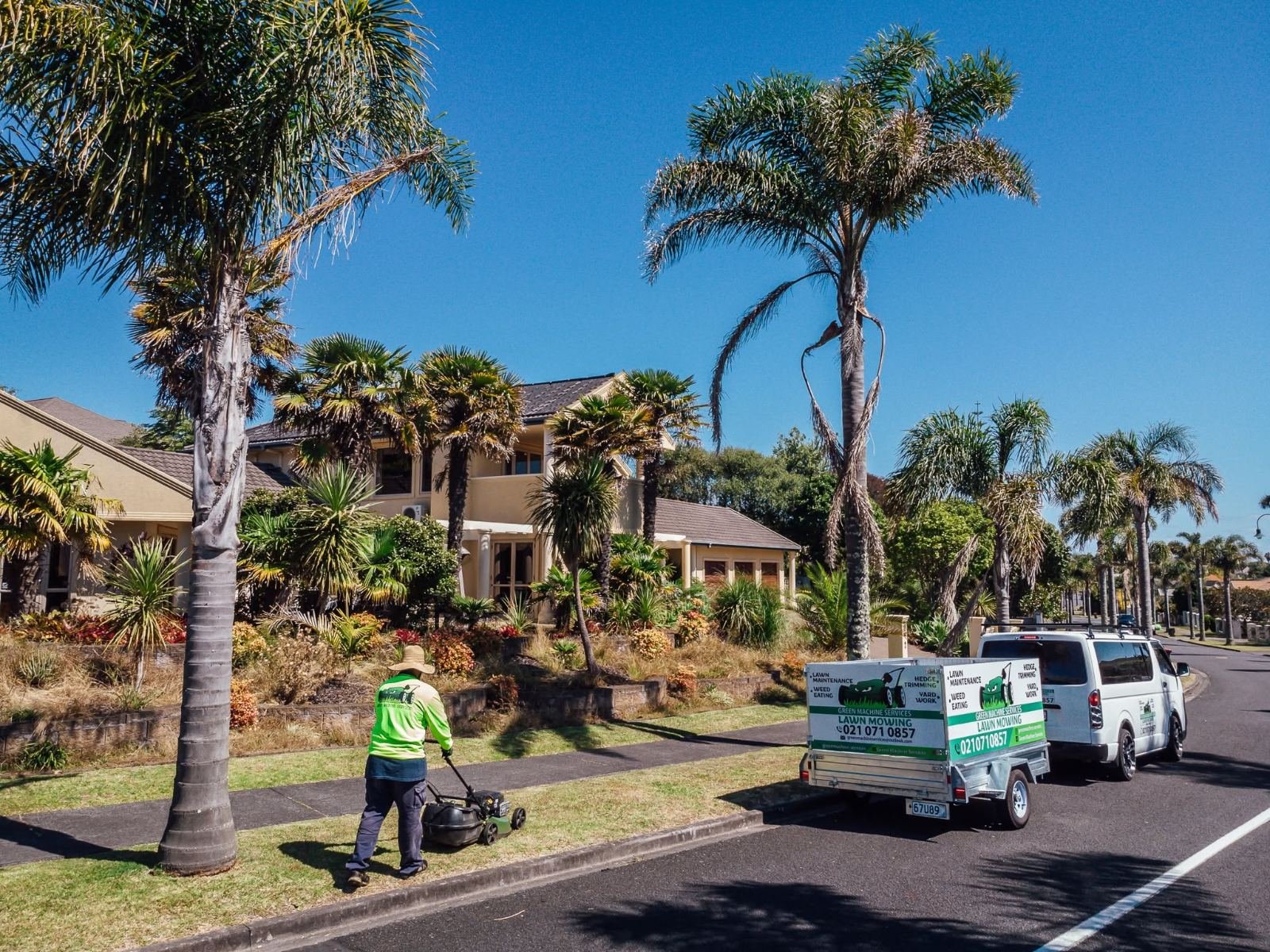 Green Machine Services mowing a lawn on an Auckland street